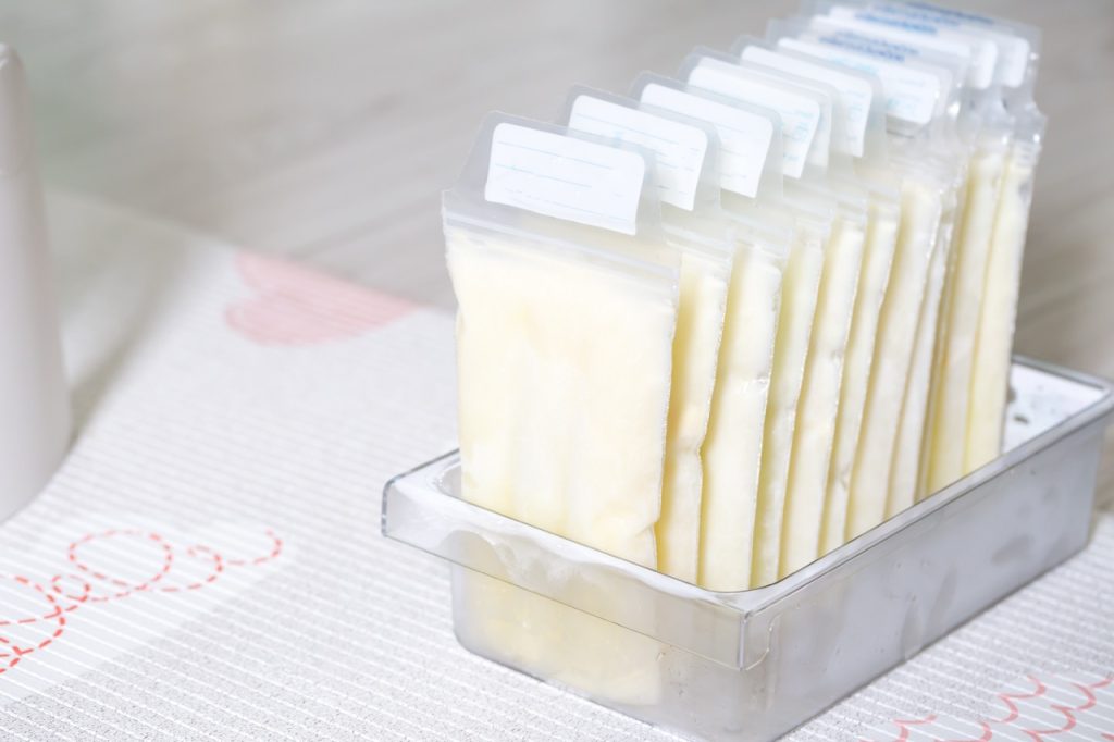 Stored plastic bags of pumped breast milk organized for feeding, hydration, and nutrition support.