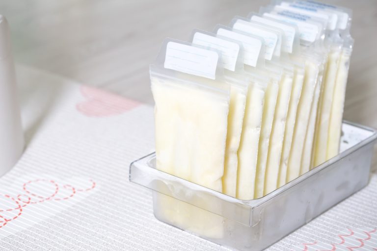Stored plastic bags of pumped breast milk organized for feeding, hydration, and nutrition support.
