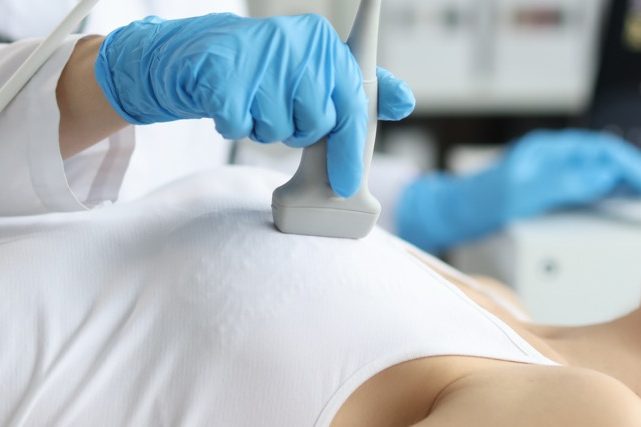 Patient receiving a breast ultrasound.